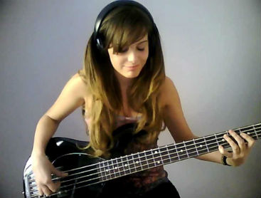 girl playing bass guitar at her lesson in Sydney