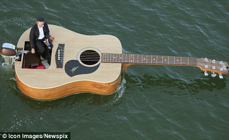 guitar teacher in sydney floating at the Eastern Suburbs beach